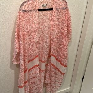 One piece swim coverup. One size. Fits like XL.